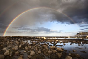 Rainbow over the sea at Robin Hoods Bay, Yorkshire, England, United Kingdom, Europe
